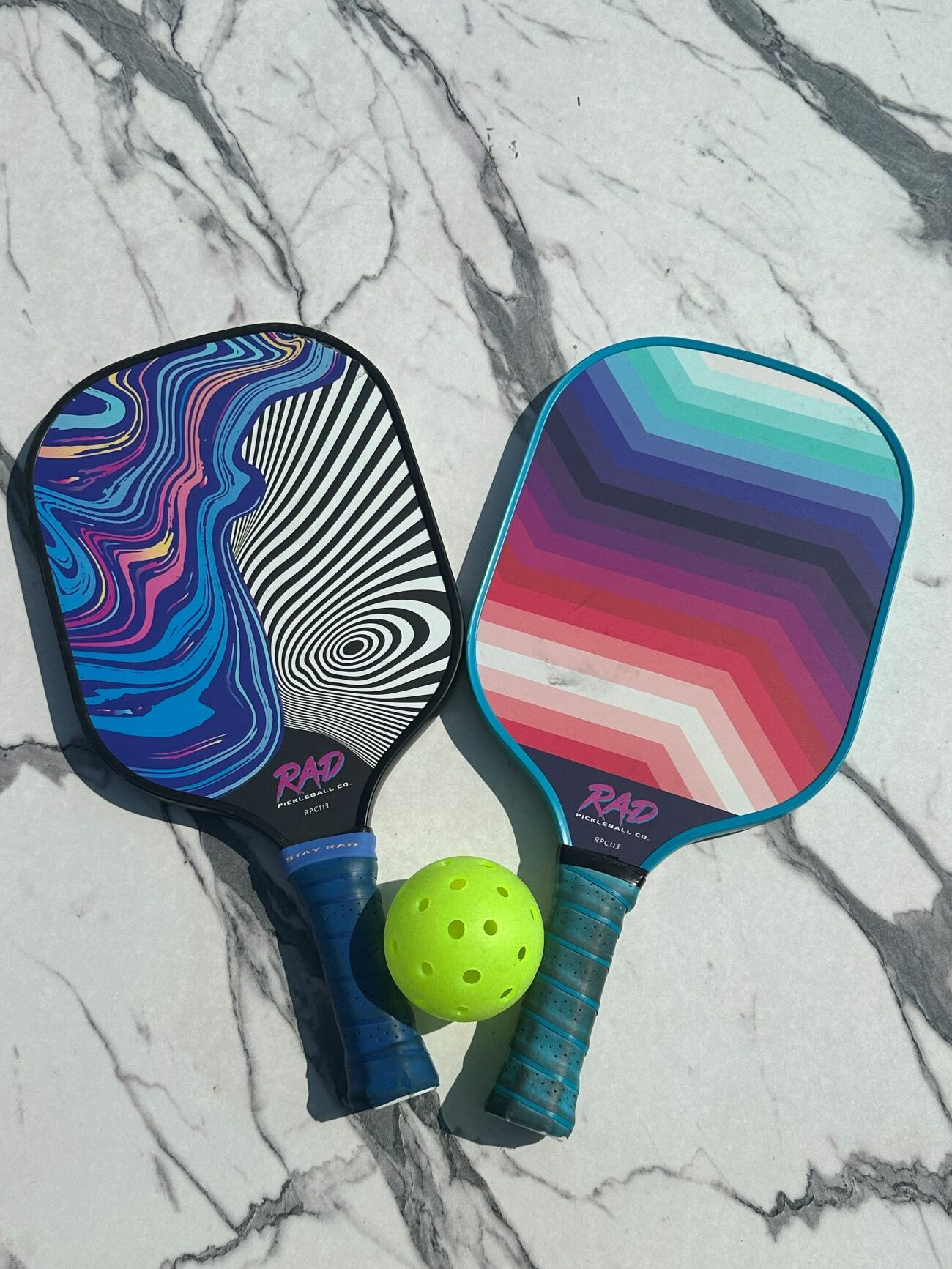 An image of two pickleball paddles.