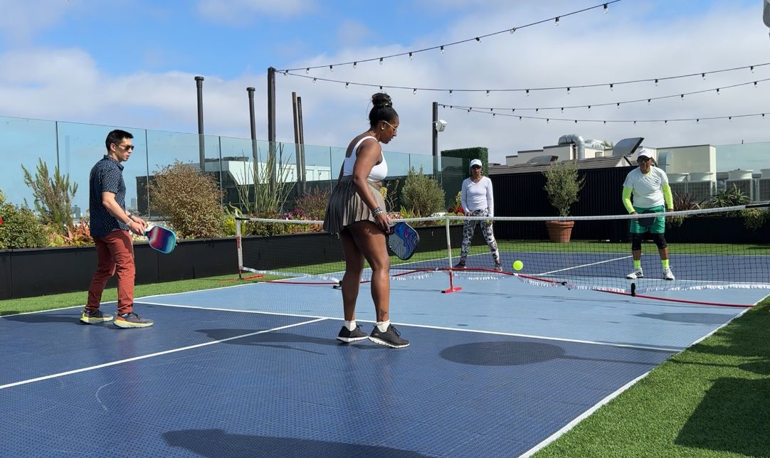 An image of people playing pickleball.