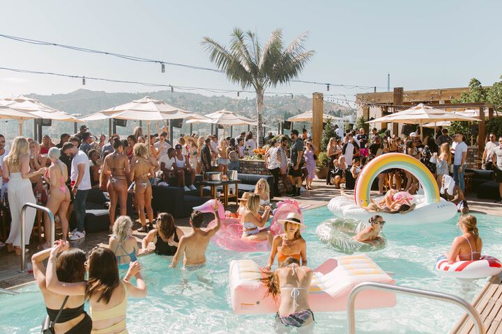 An image of people at a pool party at the Highlight Room for LA Pride 2024.