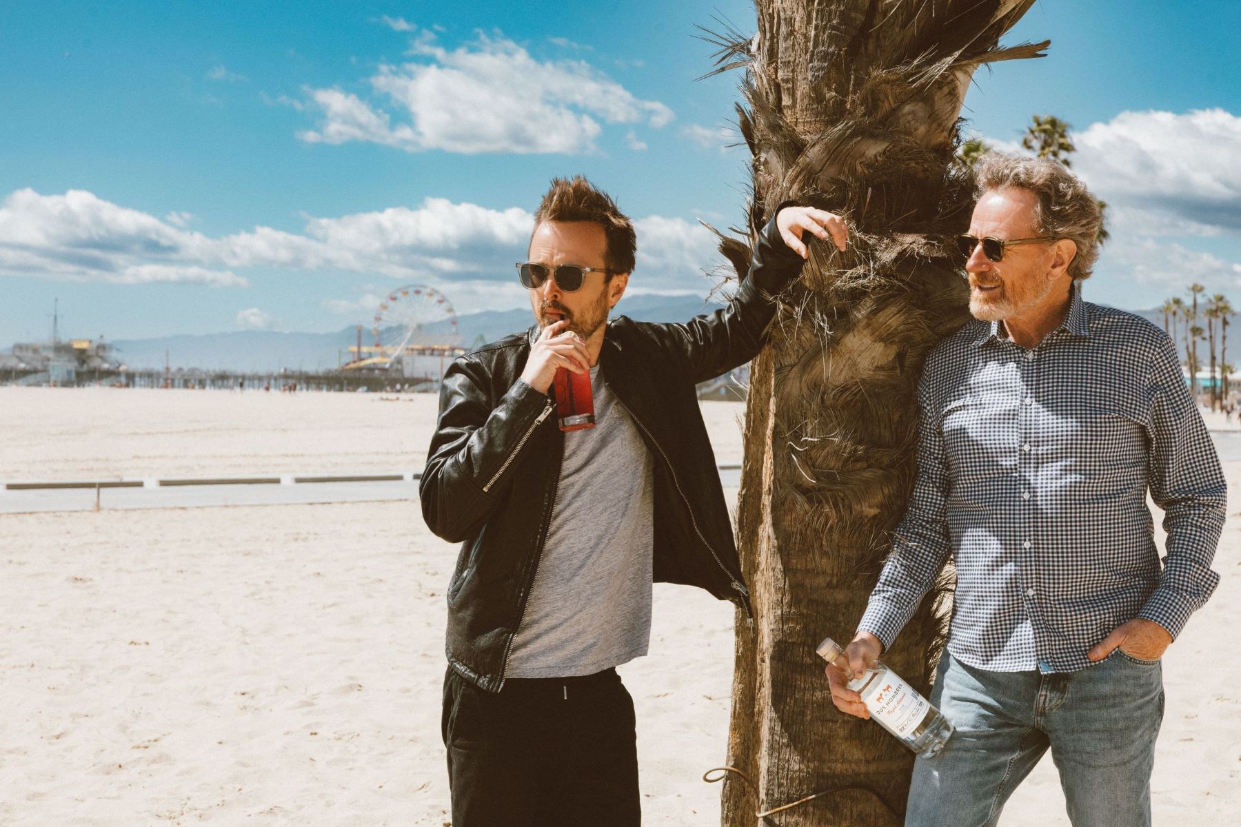 An image of Bryan Cranston and Aaron Paul with a bottle of their Dos Hombres Mezcal.