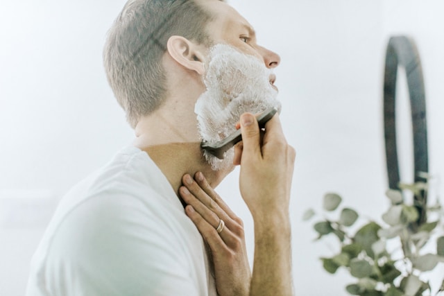 An image of a man shaving.