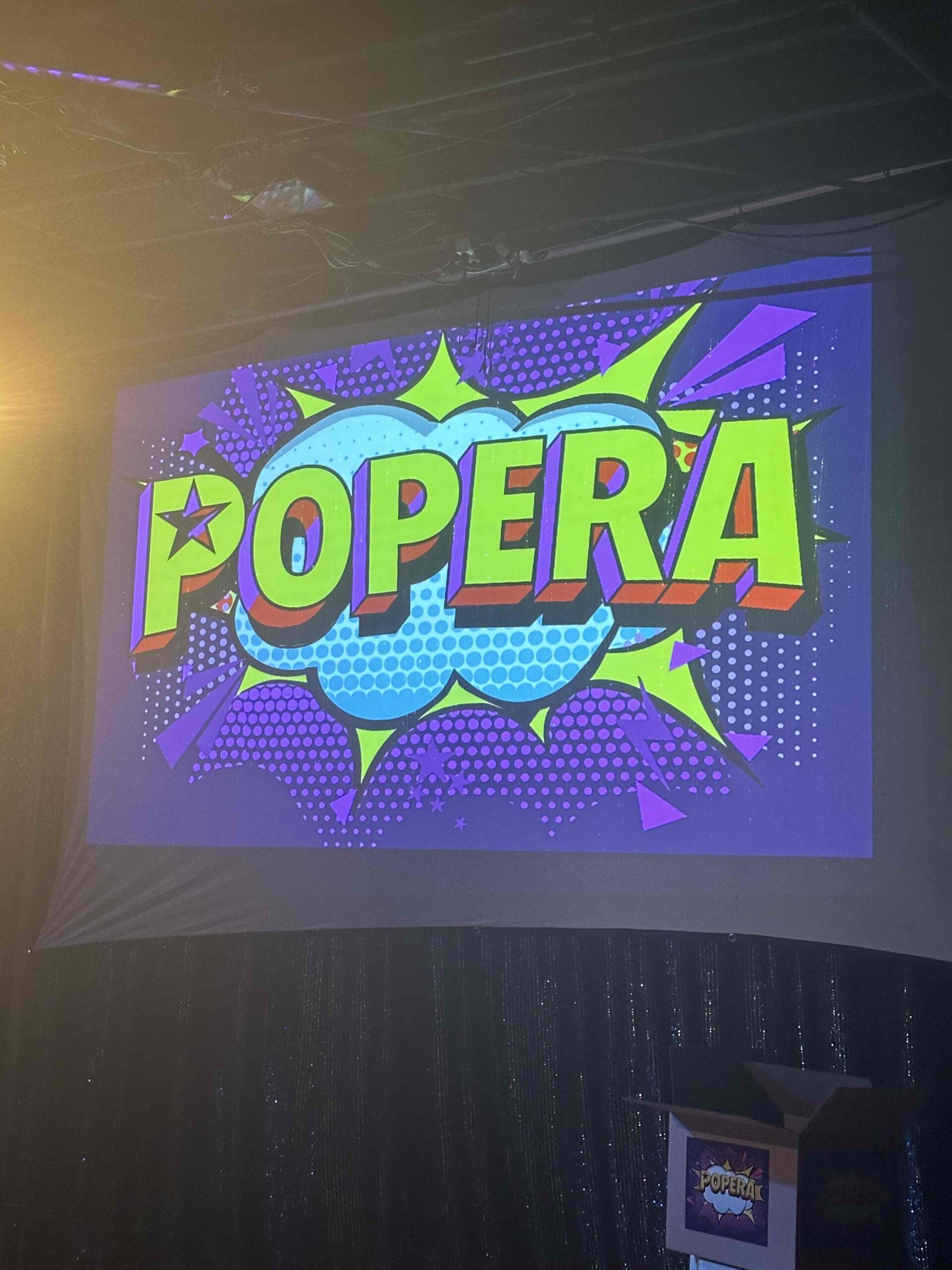 An image of the sign saying popera.