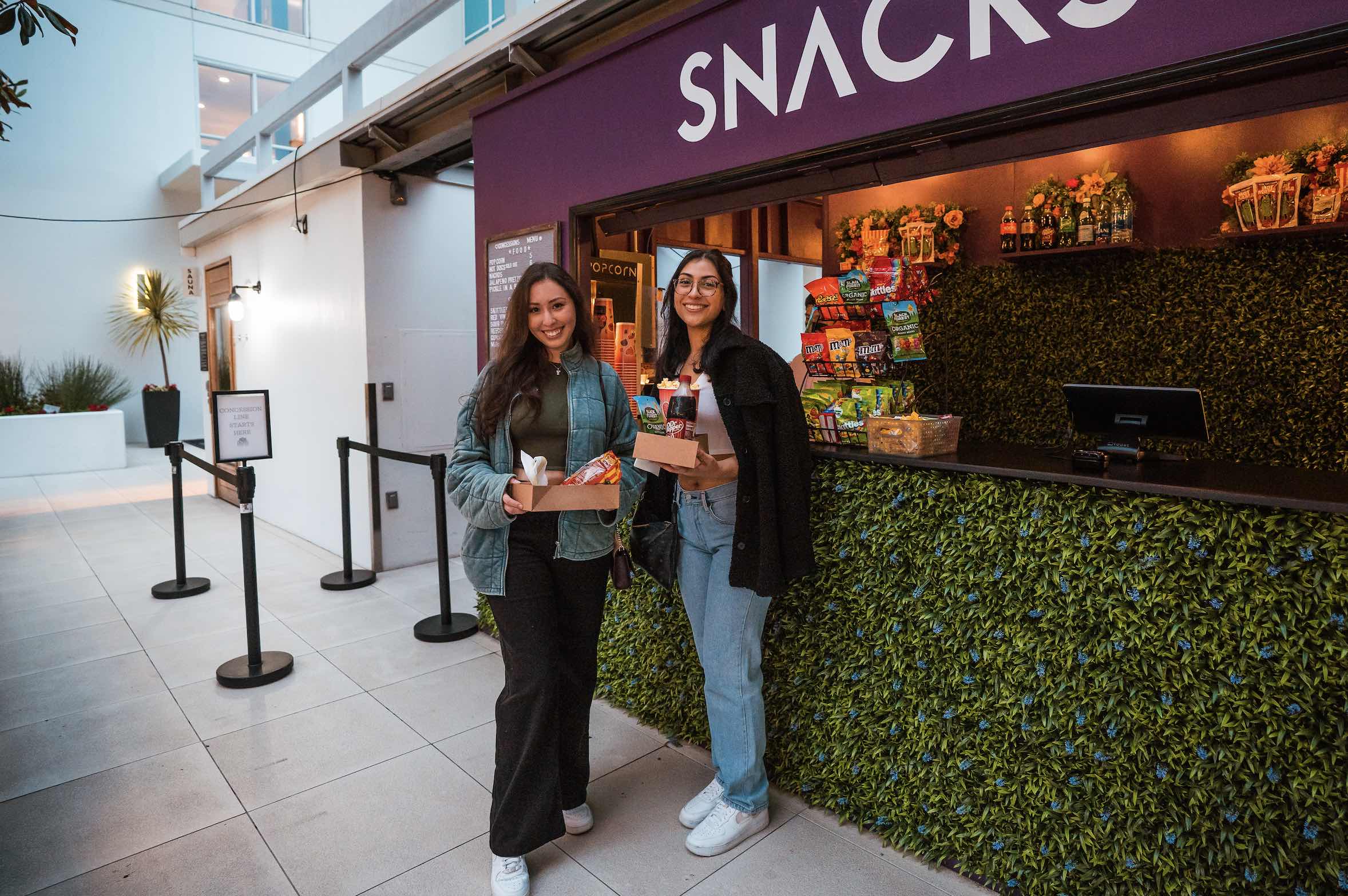 An image of people at the concession stand at Rooftop Cinema Club.