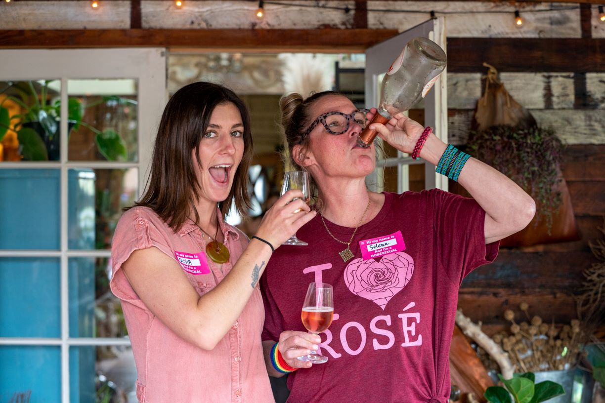 An image of people sipping rose wine at the Rose on Rose wine festival.