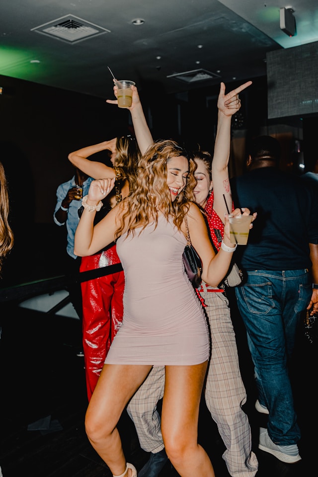 An image of women dancing at a nightclub.