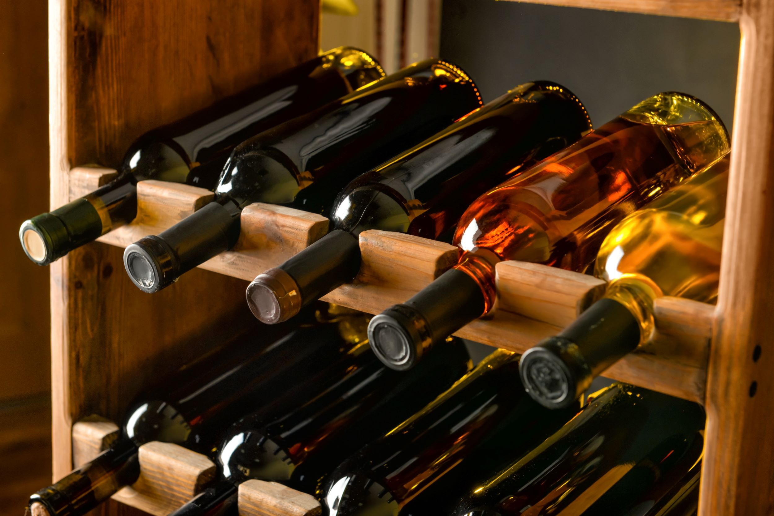 An image of bottles of wine on a wine rack.