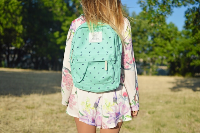 An image of a girl wearing a backpack for her girls back to school clothes.