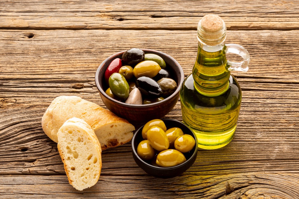 An image of tapas with a selection of olives.