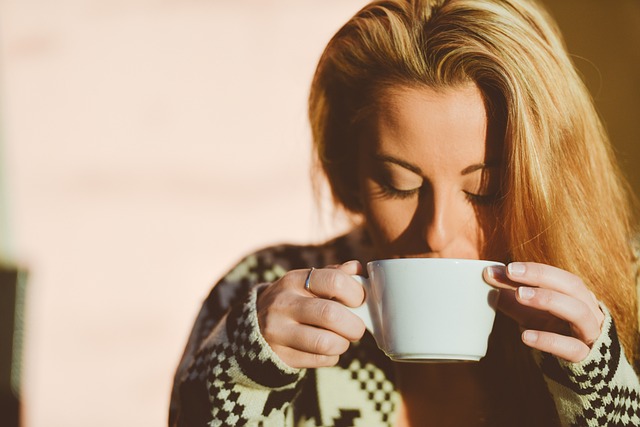 An image of a women drinking French Press coffee.