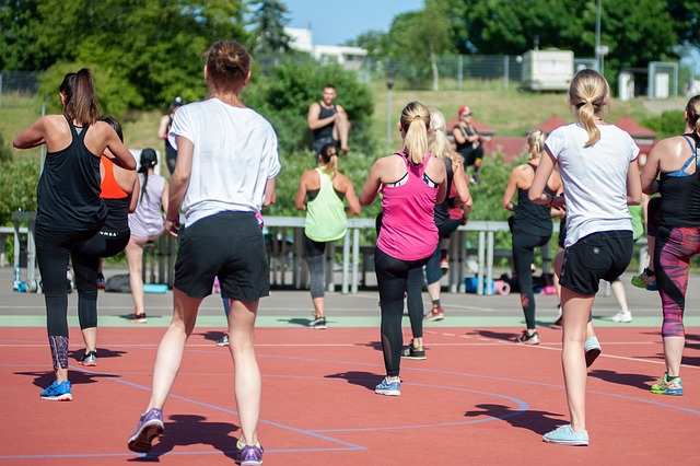 An image of a group of people doing an outdoor fitness class.