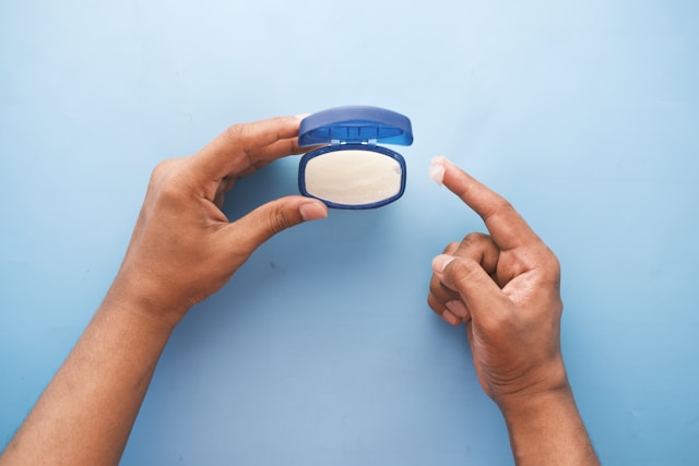 An image of someone using petroleum jelly.