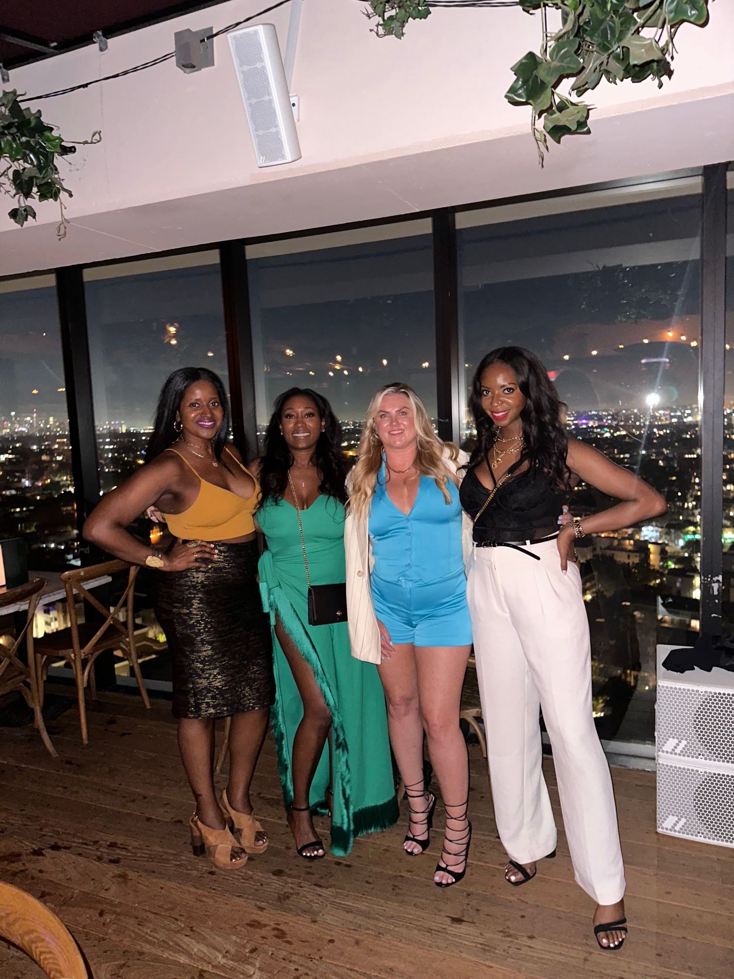 An image of lifestyle blogger and friends at Harriet's rooftop lounge.