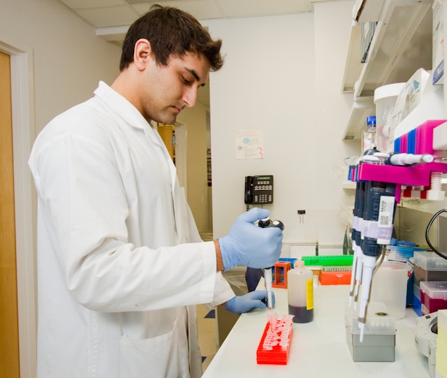 An image of a man performing lab testing.