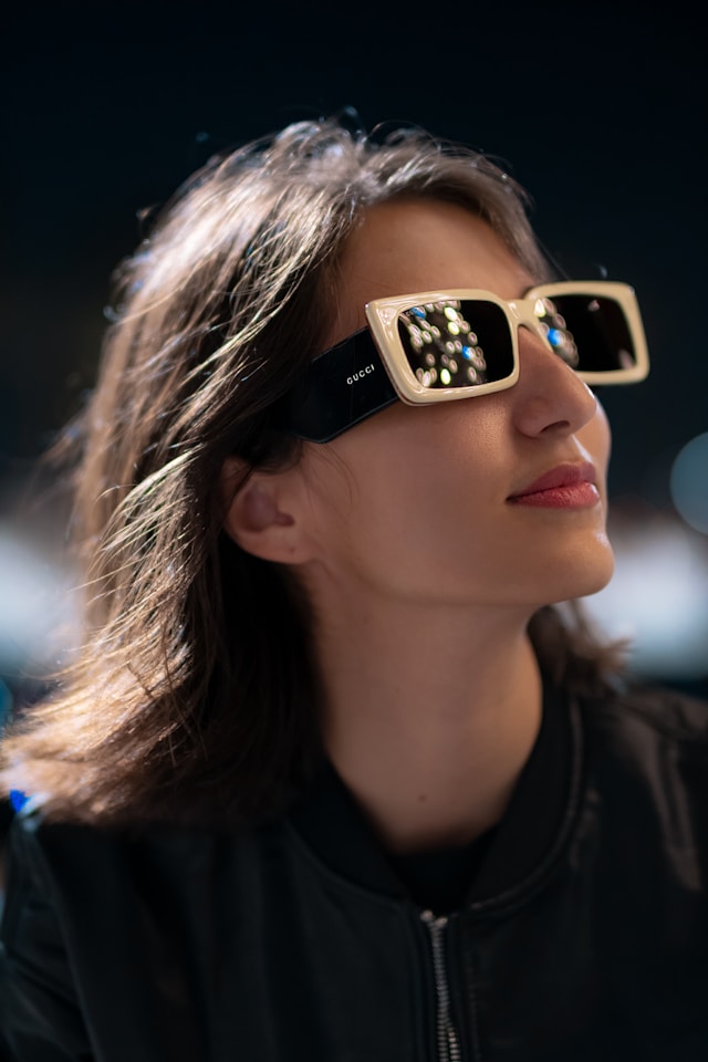 An image of a woman wearing Gucci sunglasses.