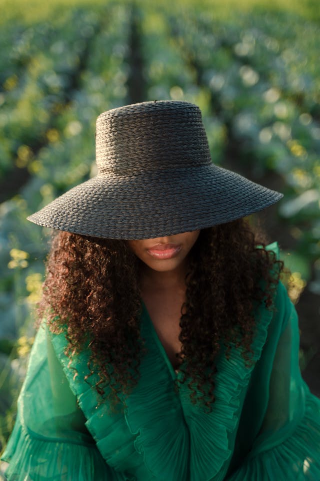 An image of a woman wearing a green dress, a Fall Fashion 2024 trend