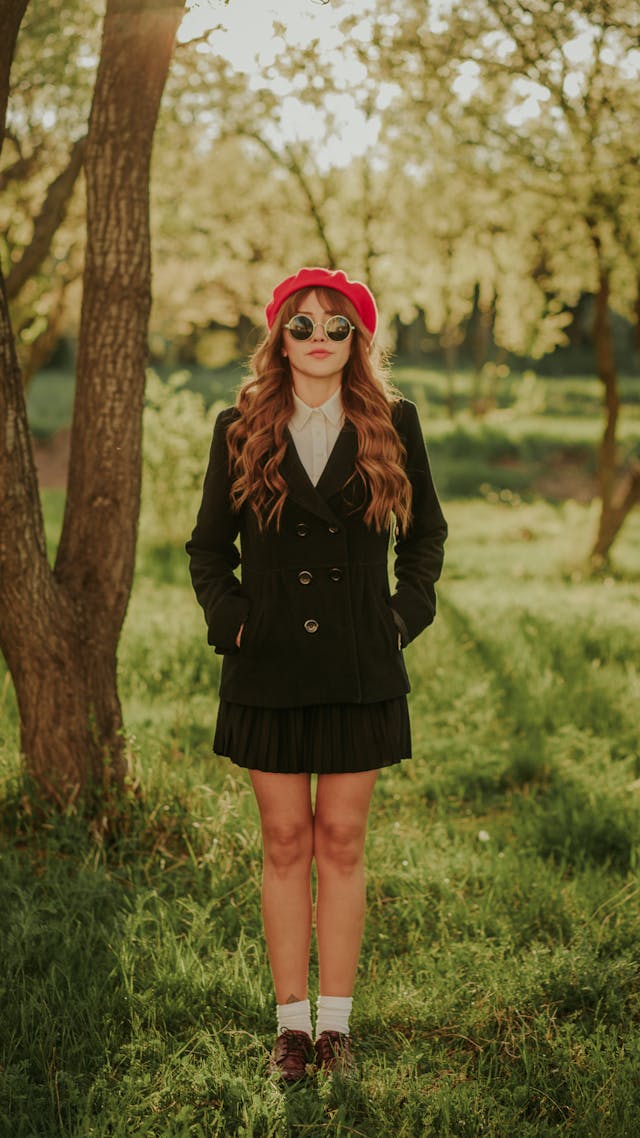 An image of a girl in a pleated skirt.