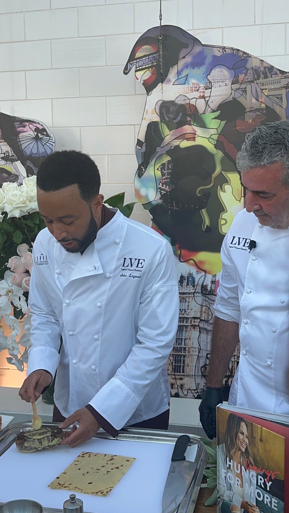 An image of John Legend and The London West Hollywood Executive Chef Anthony Keene go head-to-head with a showdown to make Beef Wellington.