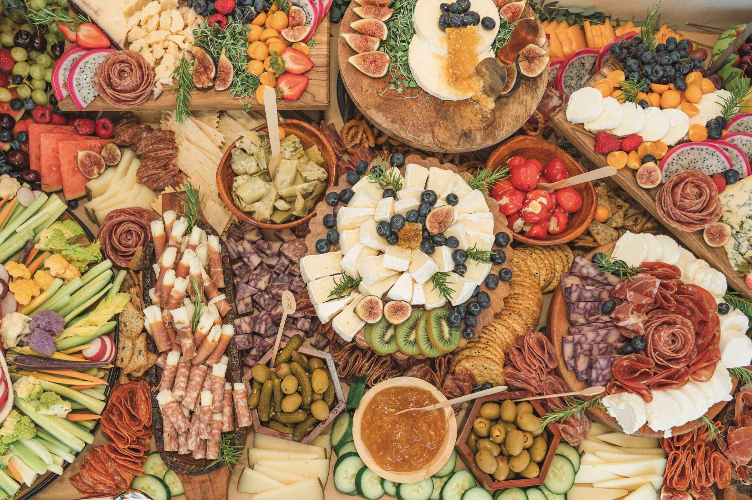 An image of the stunning charcuterie and fruit display presented by Charcuterie by P, led by Patricia Ambriz. 