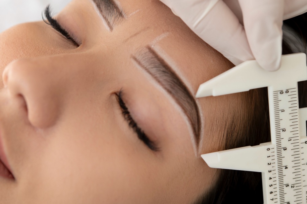 An image of a woman getting prepped for nano brows.