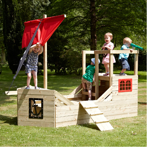 An image of children playing in a kids playhouse.