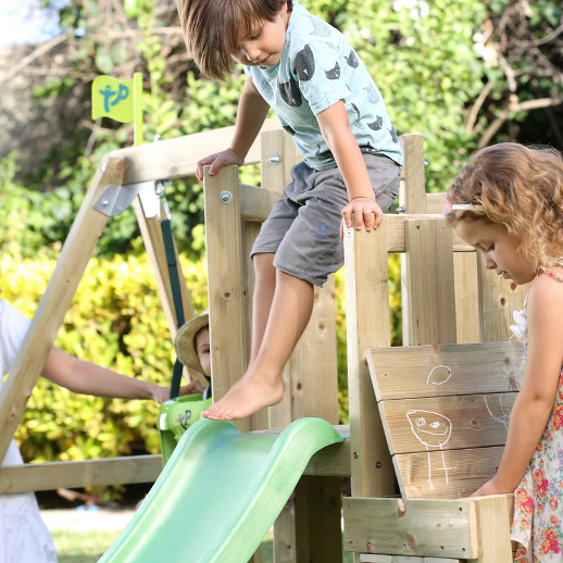 An image of a child playing on a slide.