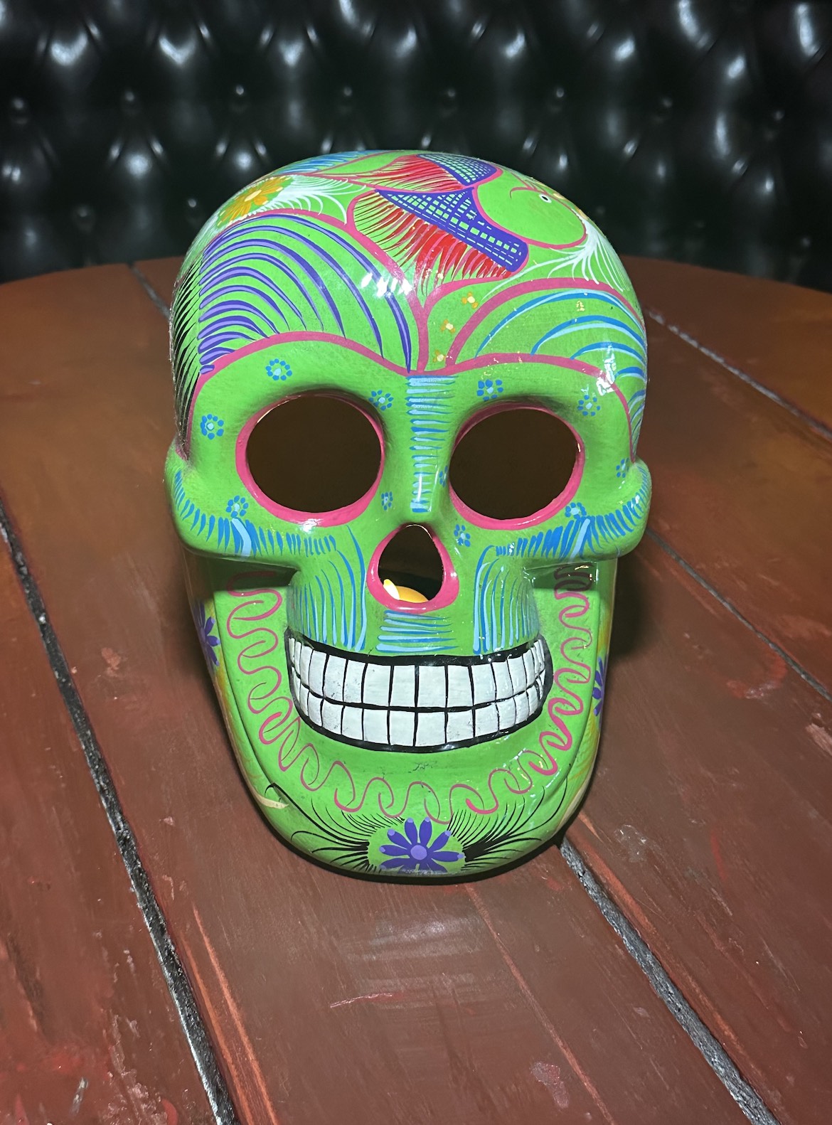 An image of a bright green skeleton at Pink Taco.