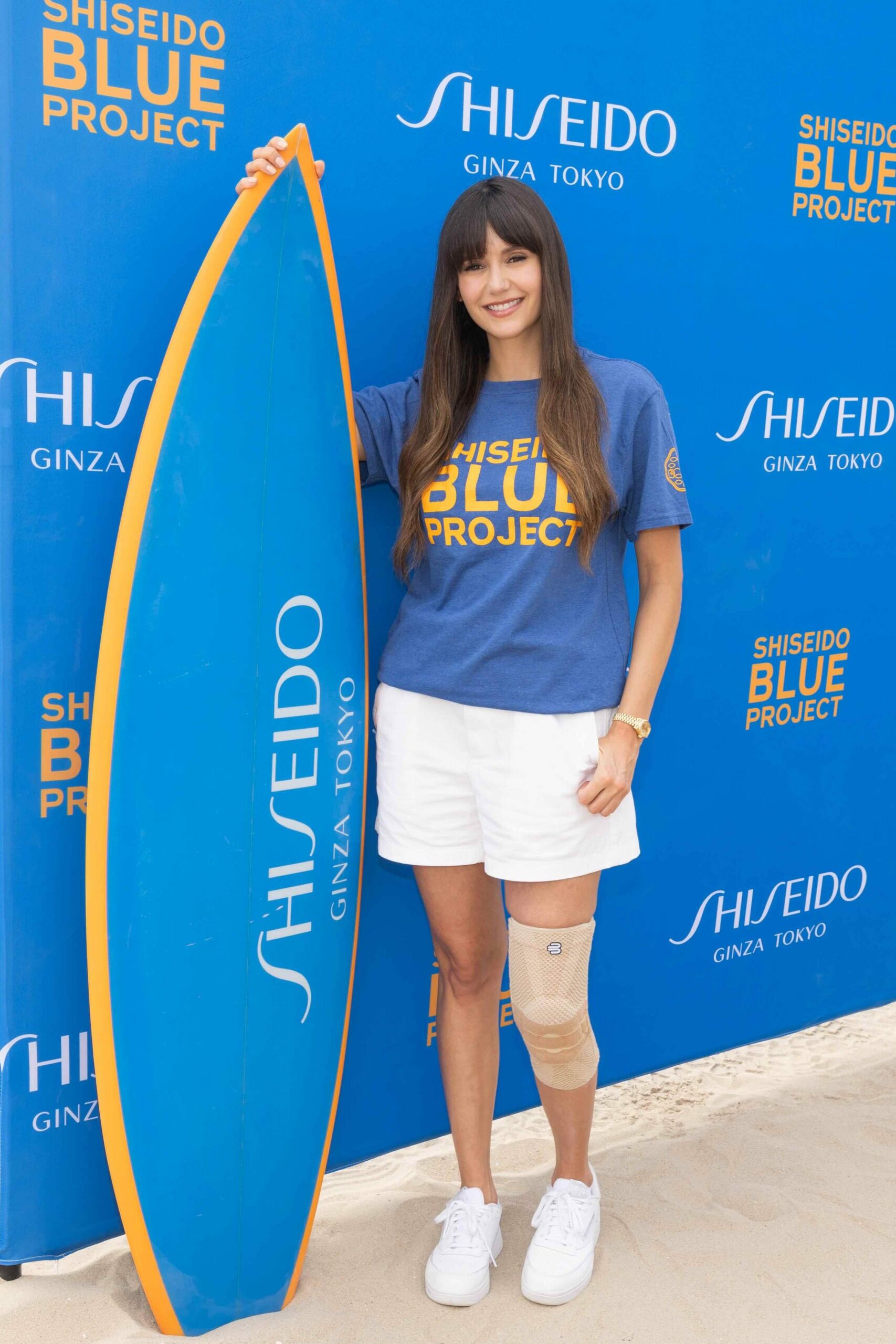 An image of actress Nina Dobrev at SHISEIDO Blue Project’s Beach Clean-Up in partnership with World Surf League’s One Ocean initiative and WILDCOAST.