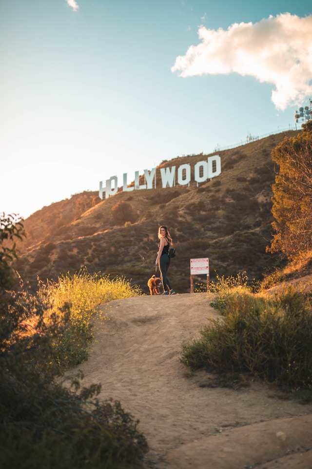 An image of a woman hiking to the Hollywood sign.