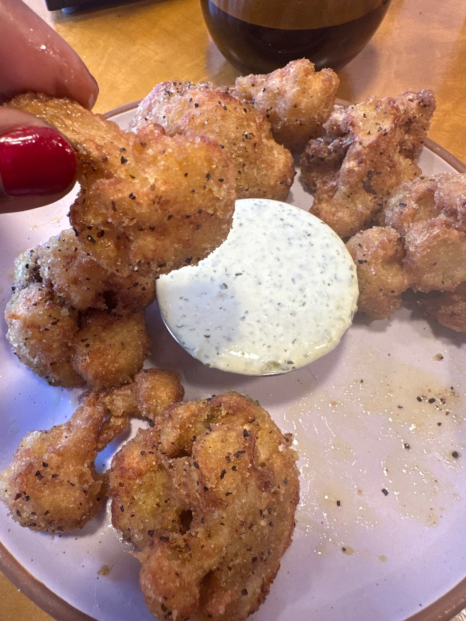 An image of Hot Tongue's Vegan Cauliflower Wings, tossed in the signature Lemon Pepper from Square Pie Guys