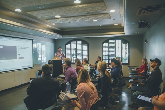 An image of a classroom with people taking a TESOL class.