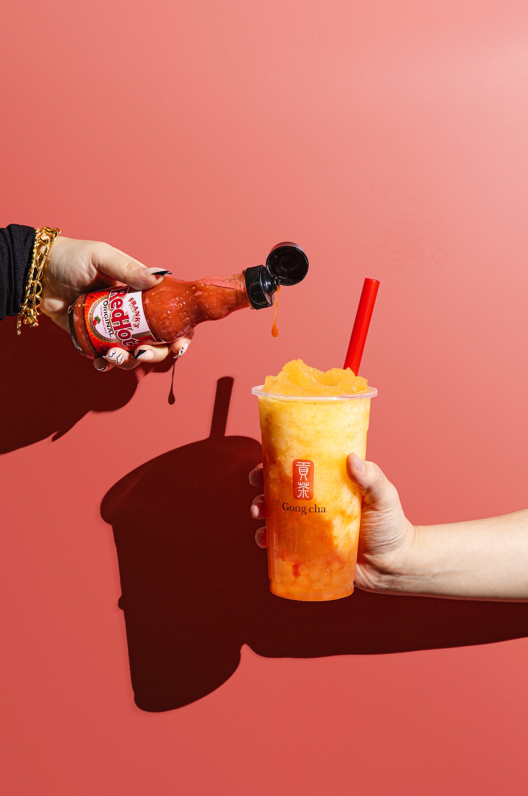 An image of a slushie with Frank;s Red Hot.