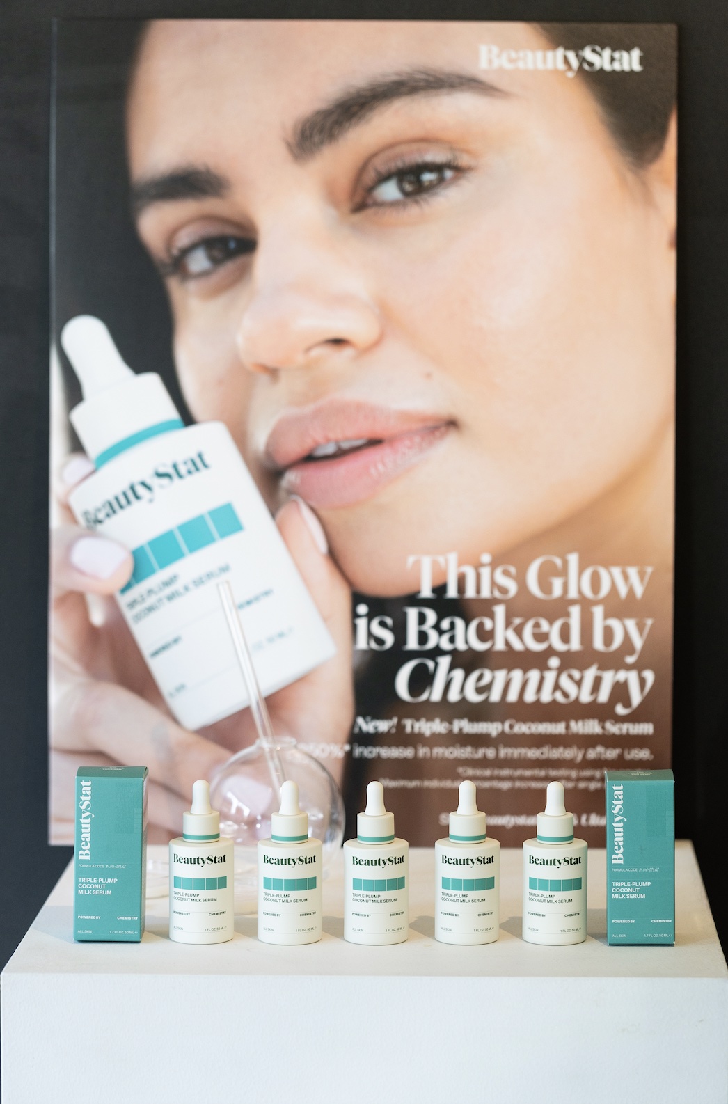 An image of a poster with BeautyStat’s Triple-Plump Coconut Milk Serum.