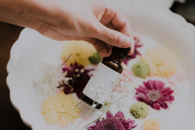 An image of someone holding a bottle of castor oil.