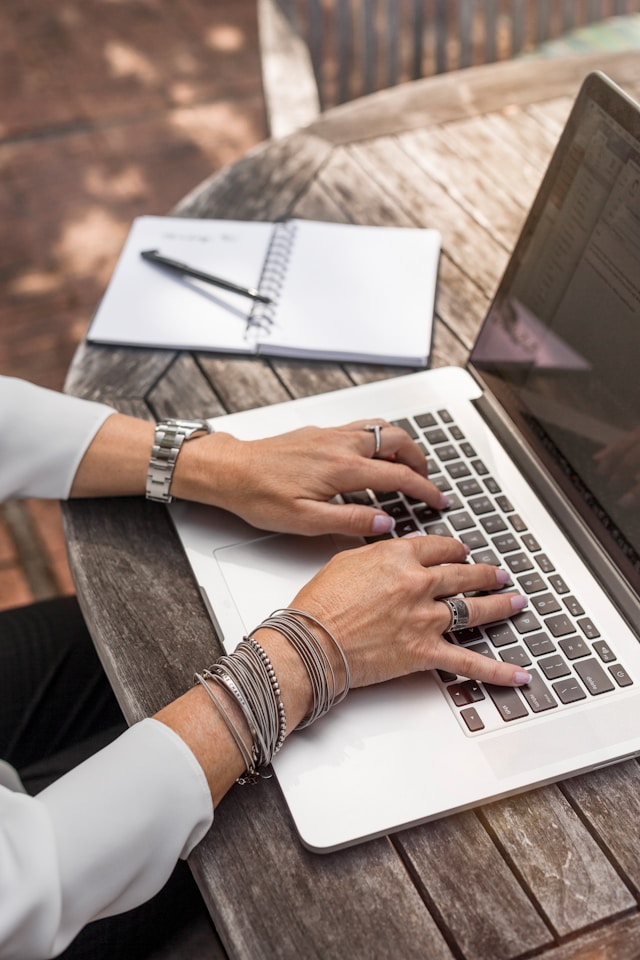 An image of a person doing research for medical school on a computer.