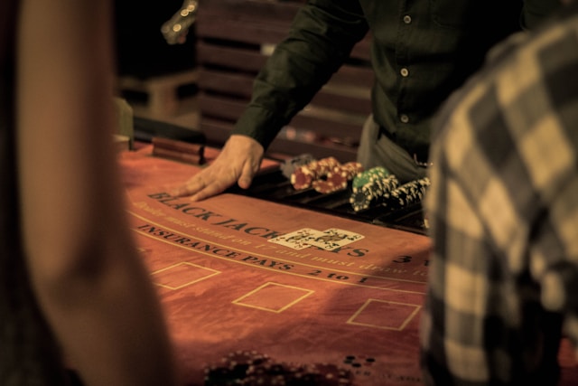 An image of a blackjack dealer at a casino.