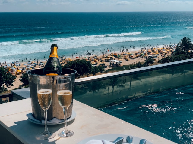 An image of an ice bucket with a bottle of Veuve Clicquot an two champagne glasses.