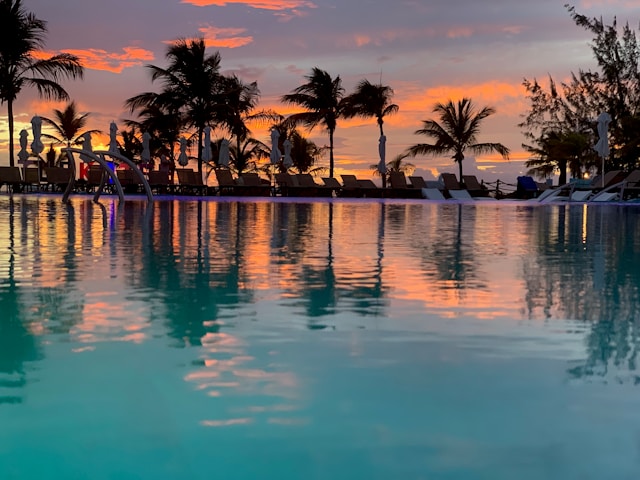 An image of the sunset reflecting off a pool in Turks and Caicos.