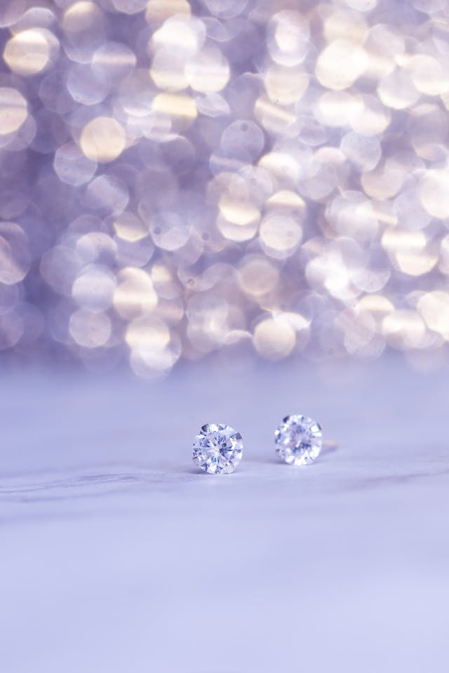 An image of a pair of diamond earrings.