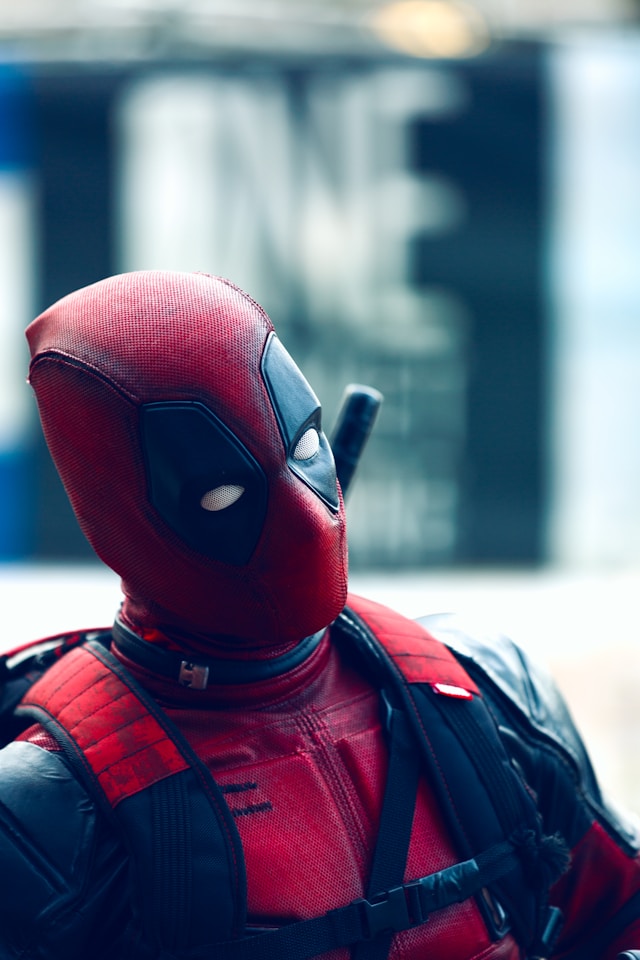 An image of a man wearing a Deadpool costume.