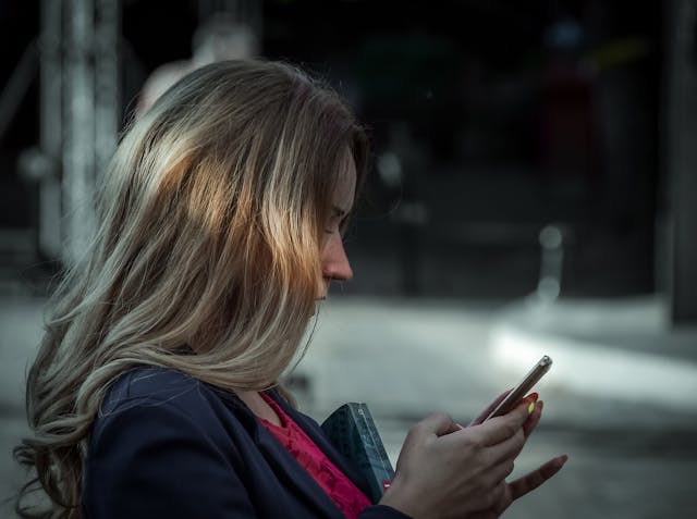 An image of a woman texting.