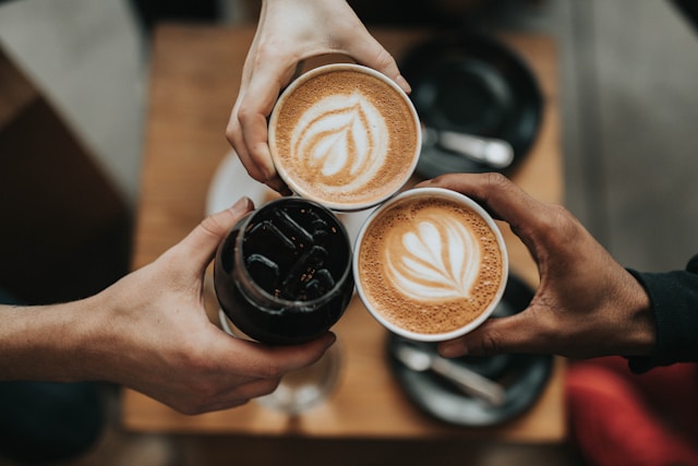 An image of people holding espressos.