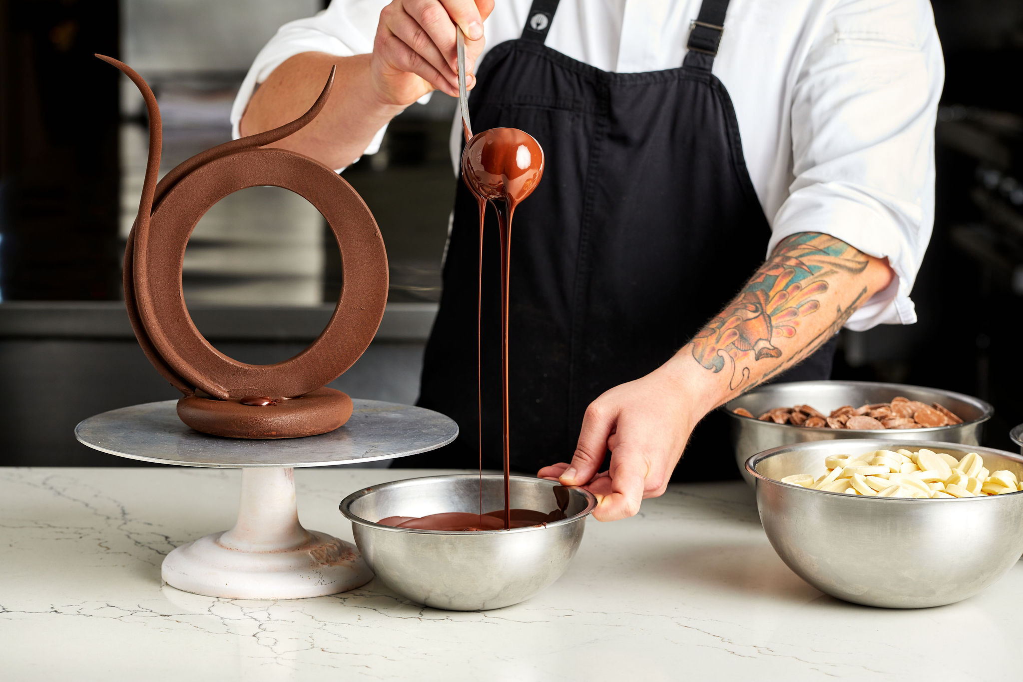 An image of the chef at the Ritz working with chocolate.