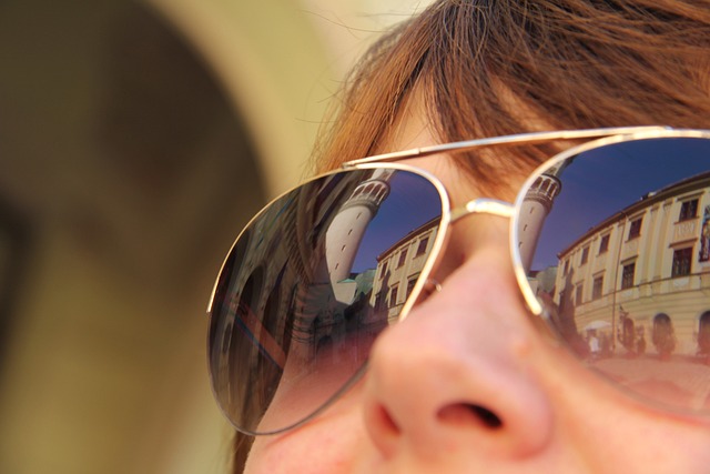 An image of a woman wearing aviator sunglasses.