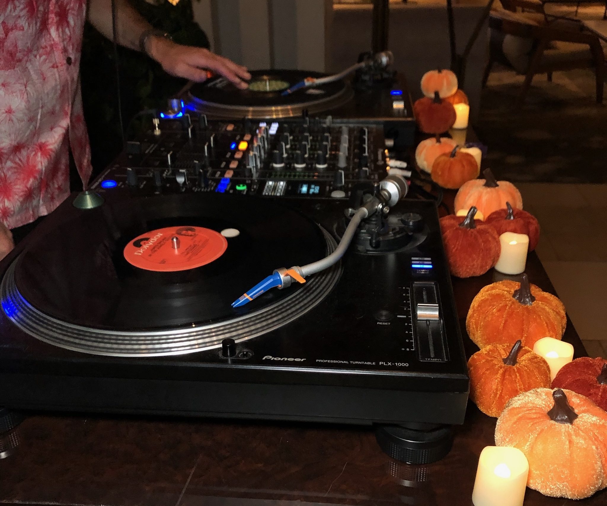 An image of turntables and a DJ spinning vinyl at the Turntable Bar at the Dream Hollywood Hotel.