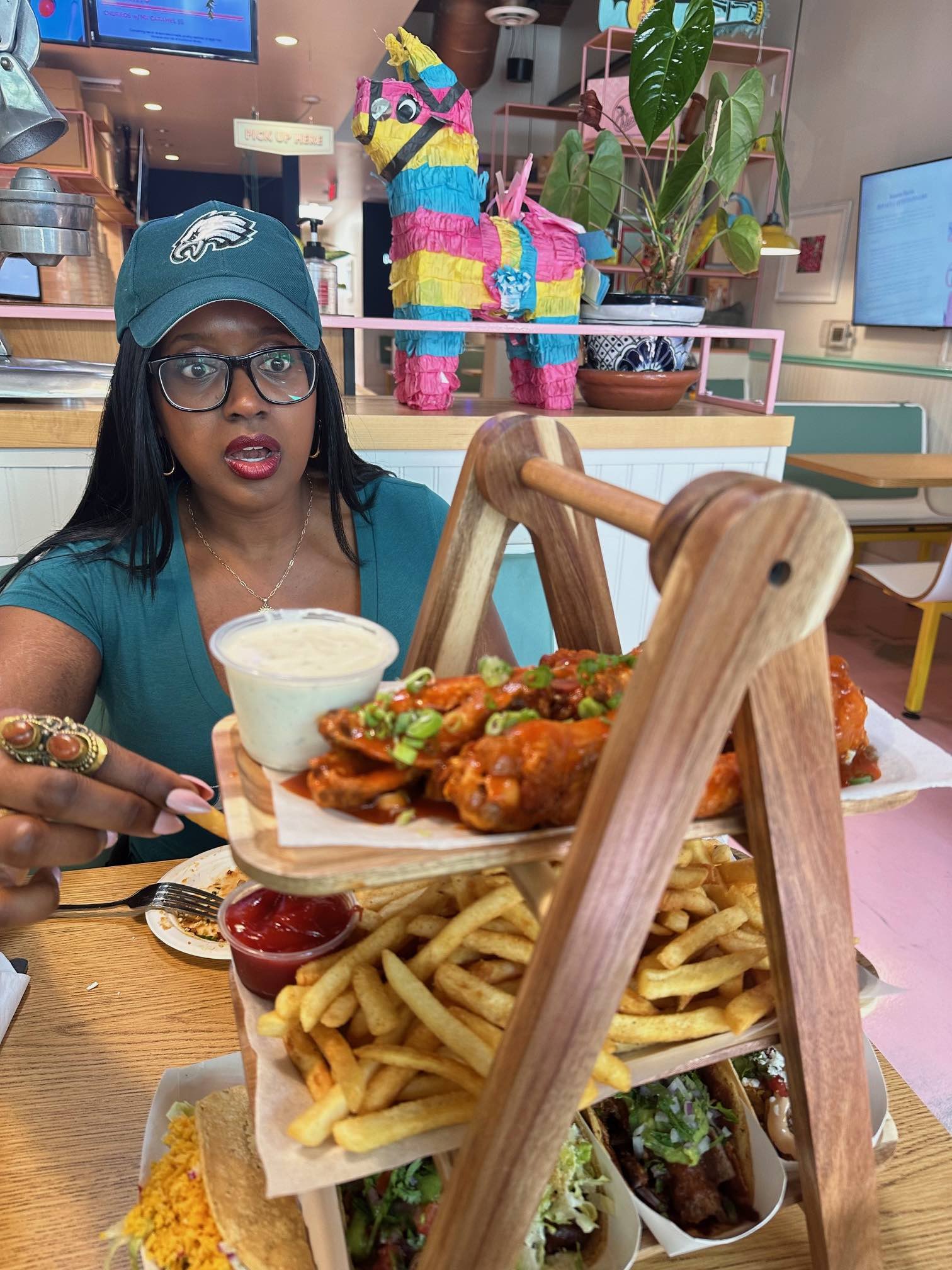 An image of lifestyle blogger Ariel with new food items at Chics Tacos.