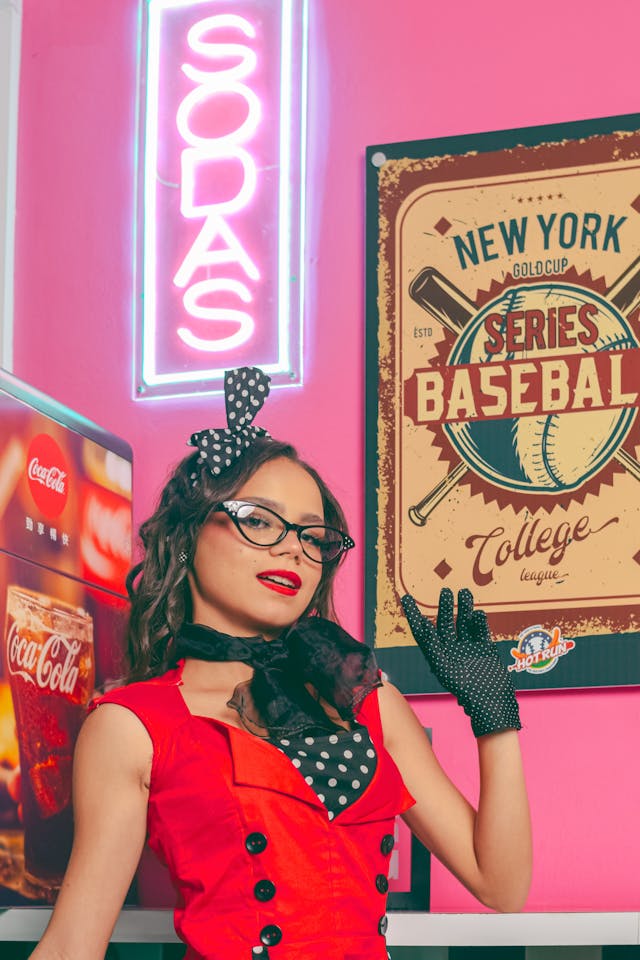 An image of a woman in front of a sign that reads Sodas. She is about to binge watch The Secret Lives of Mormon Wives.