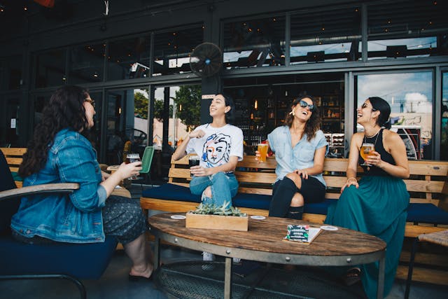 An image of women socializing and networking.