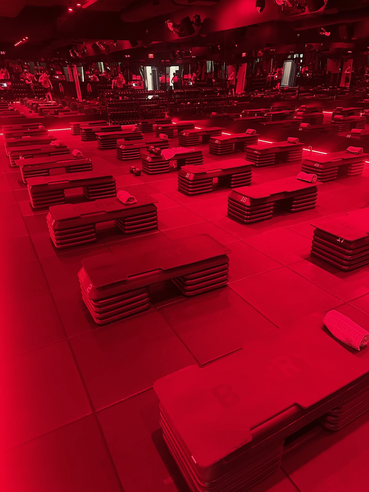 An image of the red room at Barry's Studio City. Whether you're an LA Fitness enthusiast or new to working out, Barry's inclusive community makes everyone feel like they belong, regardless of their fitness journey. 