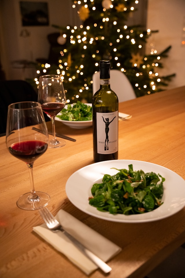 An image of a table setting with a plate of salad. Merry Christmas and happy holidays!