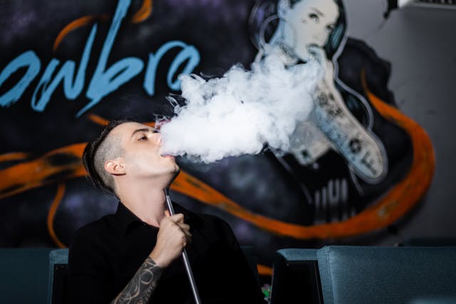 An image of a man vaping.